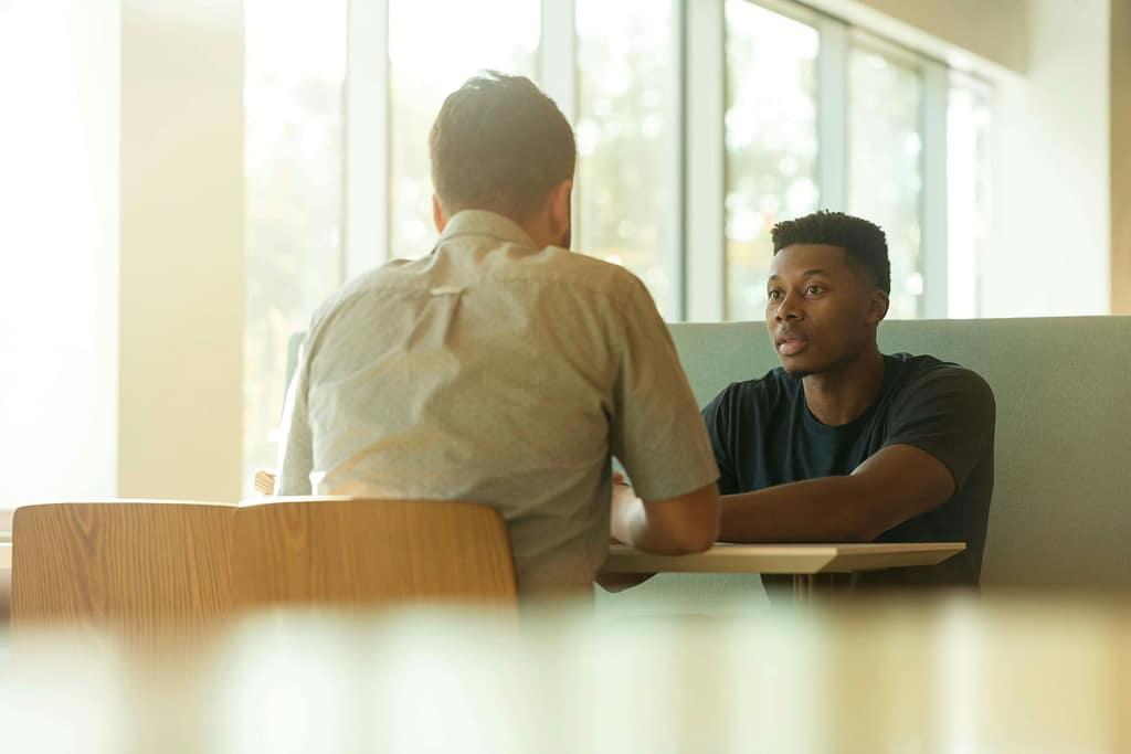 Two people in conversation during a coaching session