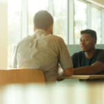 Two people in conversation during a coaching session