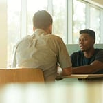 Two people in conversation during a coaching session